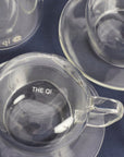 Glass cups & saucers (2)